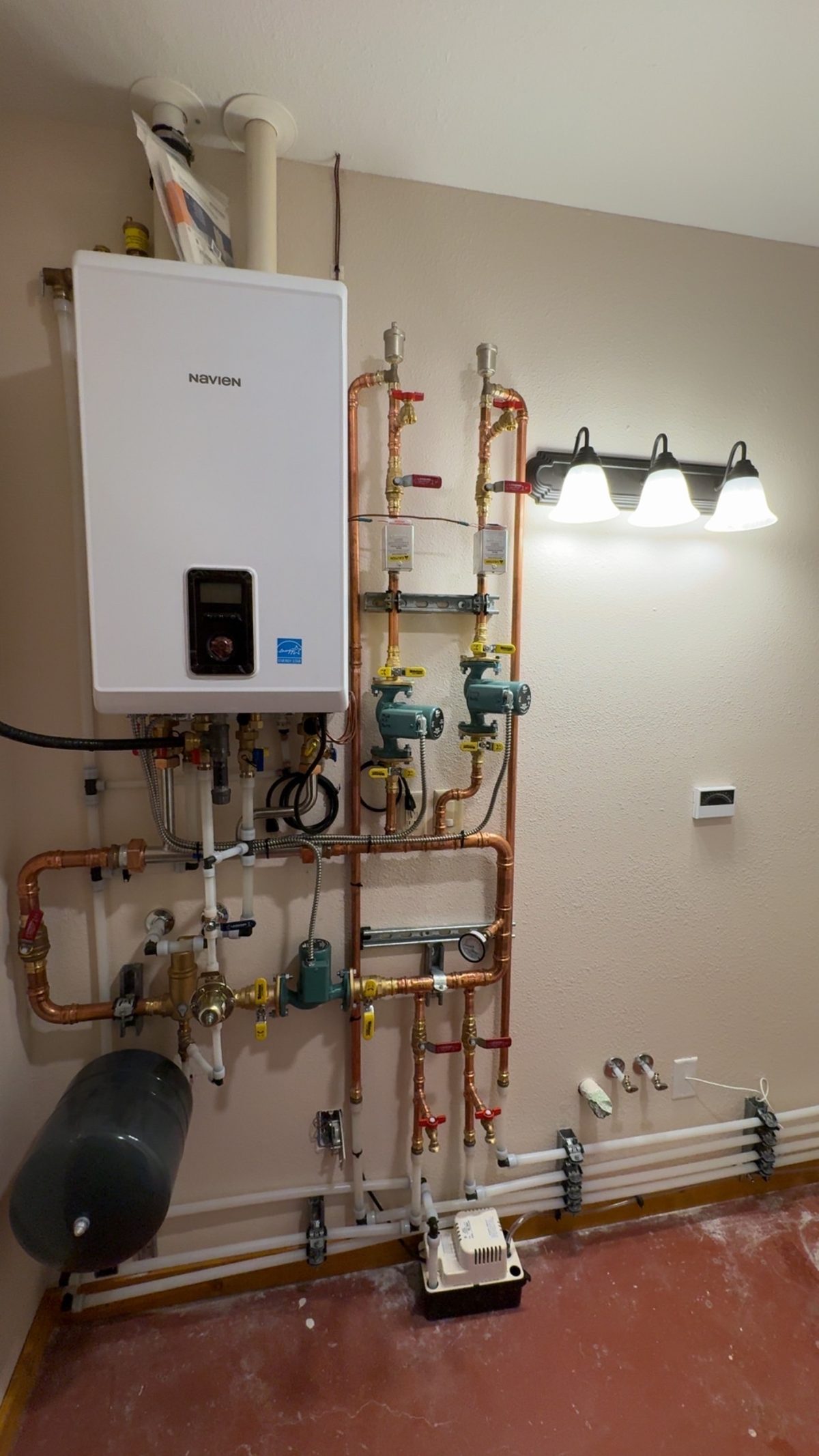 Navien boiler connected to radiant floor heating manifold