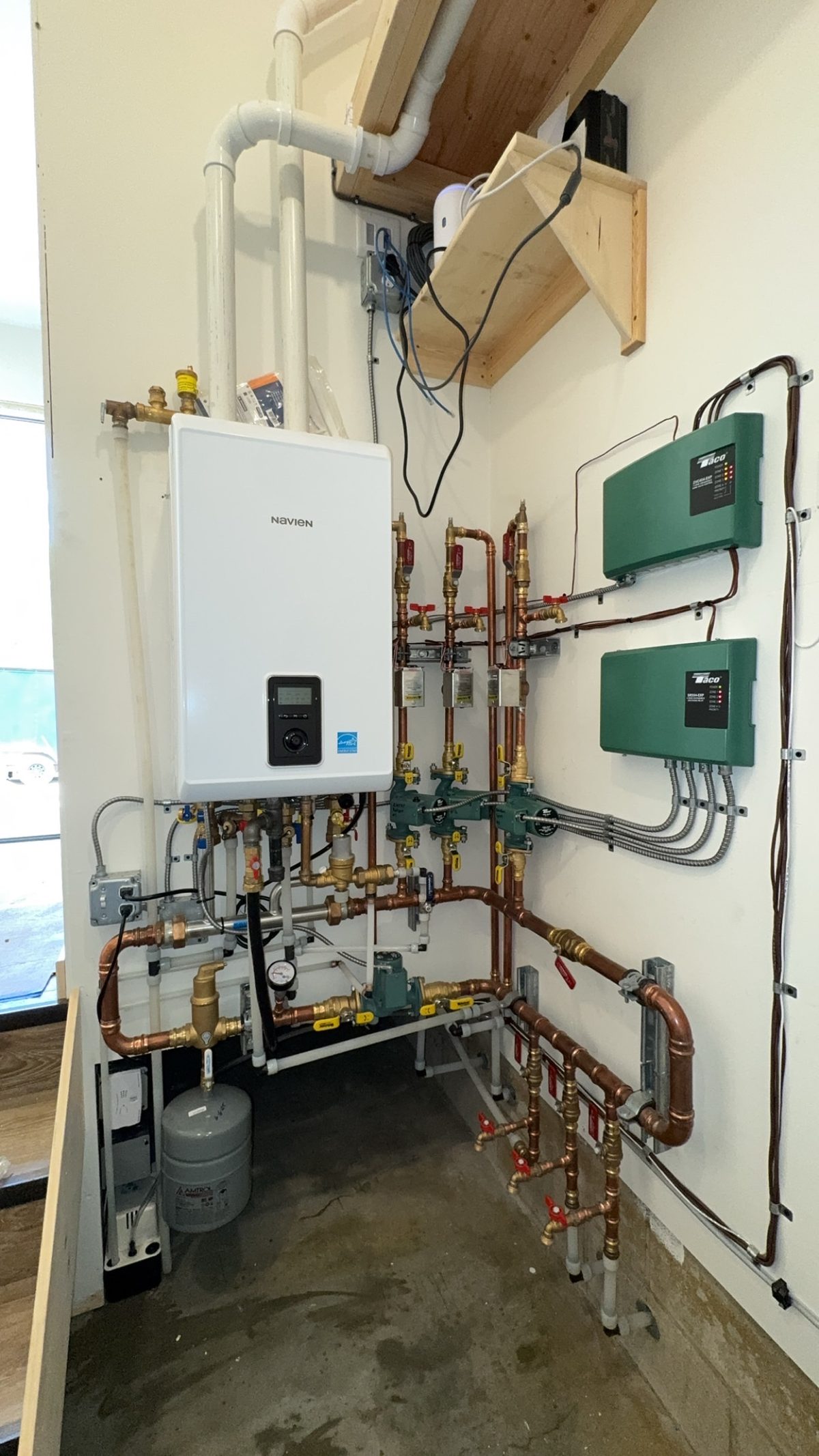 Navien boiler with Taco zone controllers installed by Wrangler Plumbing