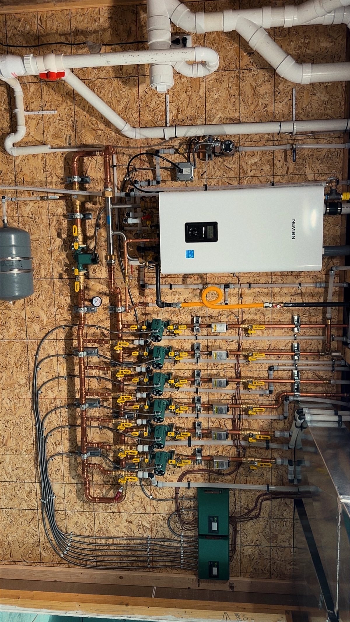 Complete Navien radiant floor heating system with multiple Taco zone pumps