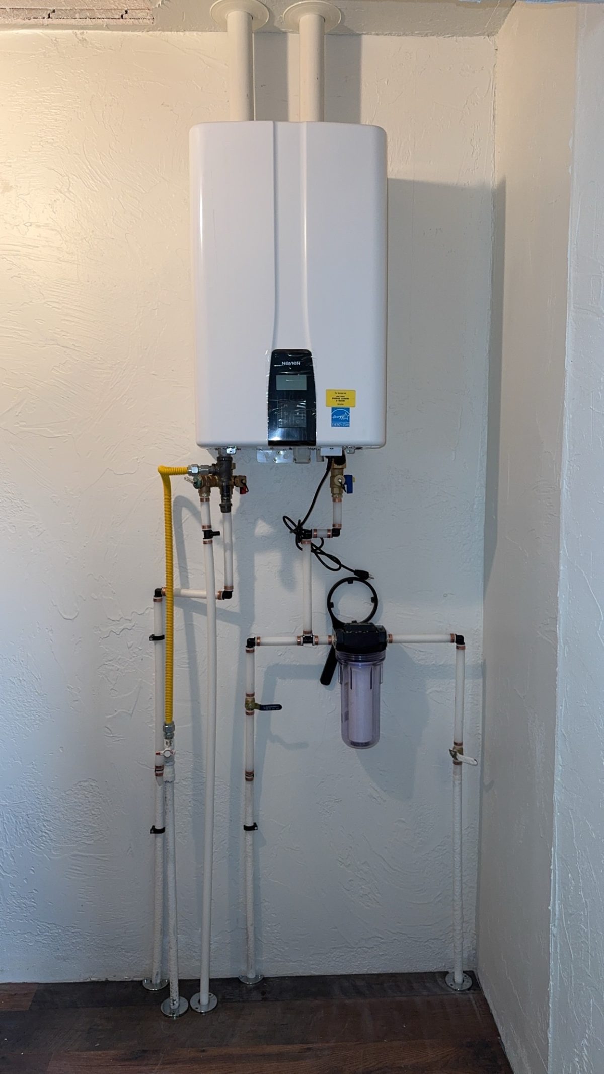 Navien tankless water heater with inline filter by Wrangler Plumbing
